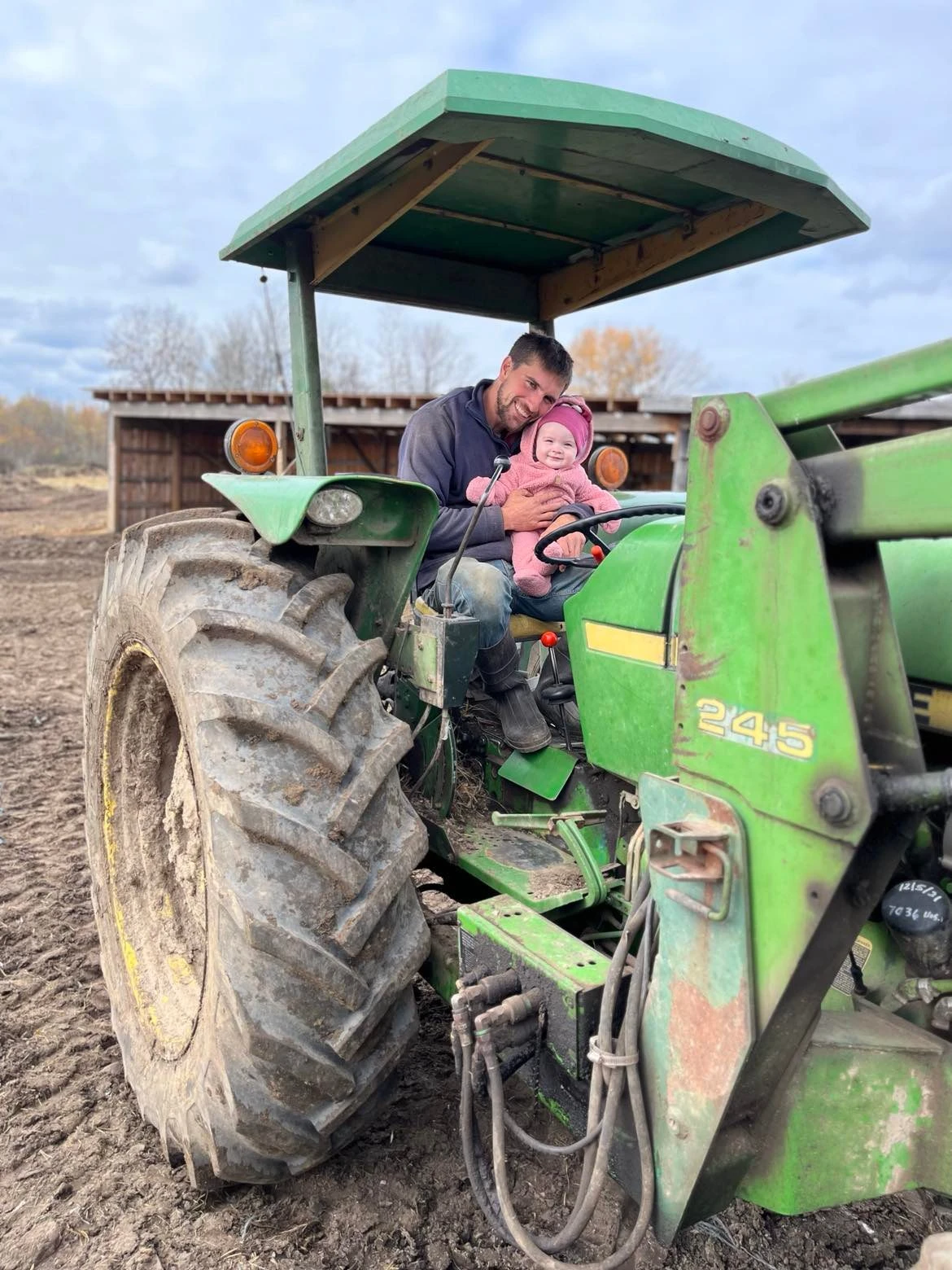 Michael and baby on the John Deere tractor