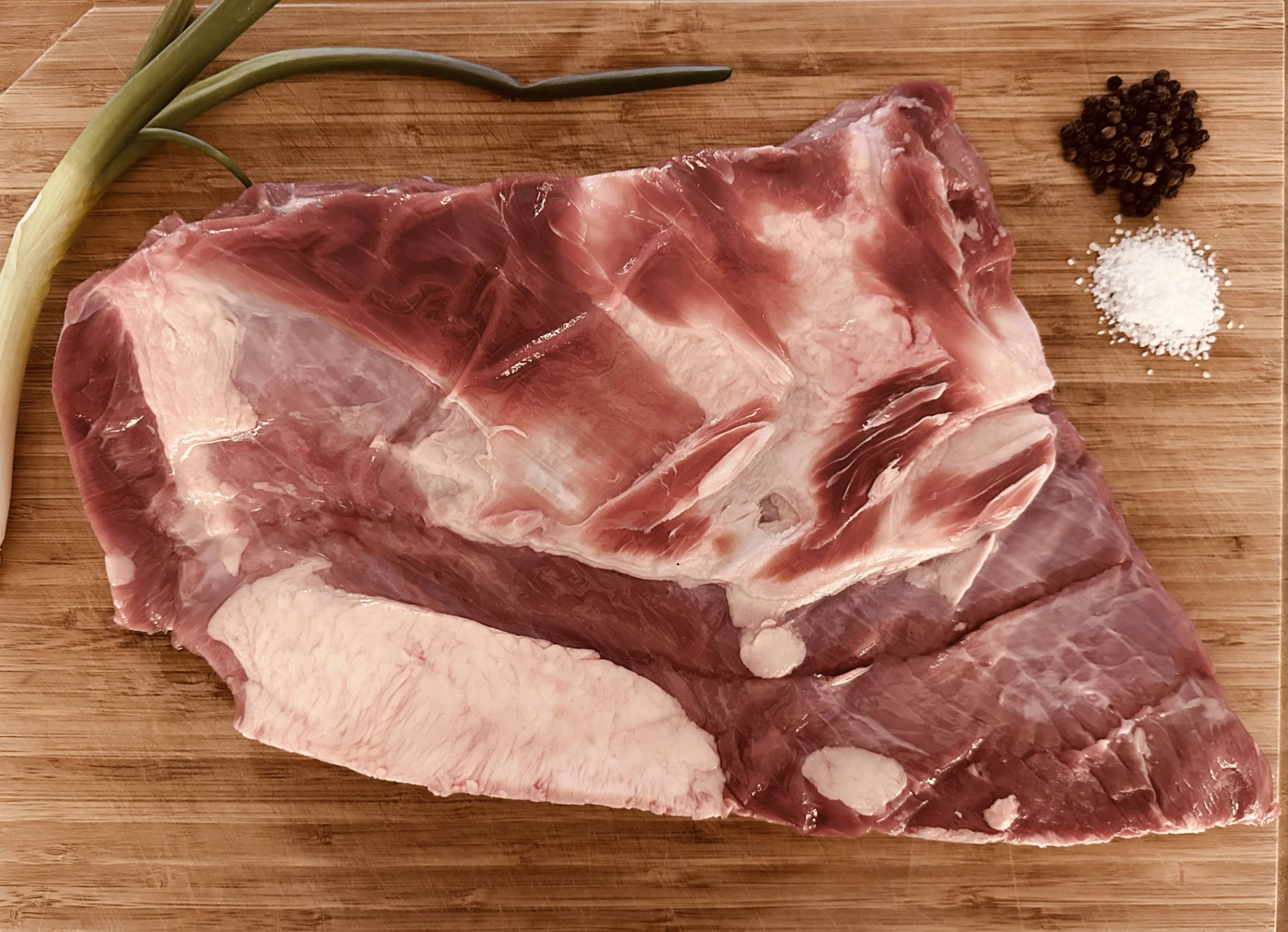 Beef spare ribs on a cutting board